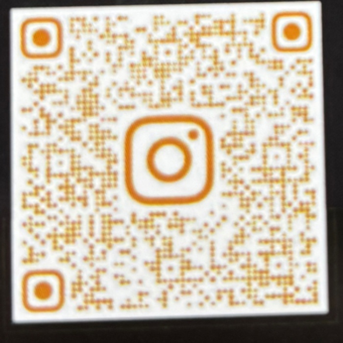 QR code linking to ON TOP Barbershop on Instagram